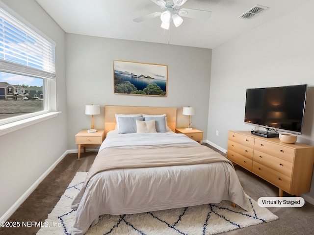 bedroom featuring carpet floors, baseboards, visible vents, and ceiling fan