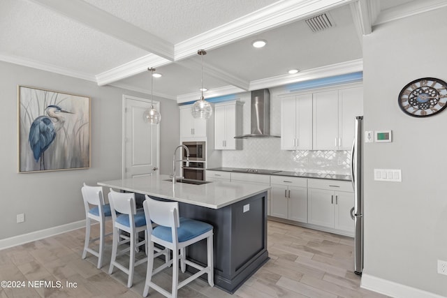 kitchen with stainless steel appliances, ornamental molding, wall chimney range hood, and decorative backsplash