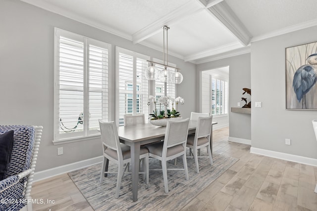 dining room featuring light wood finished floors, ornamental molding, and beamed ceiling