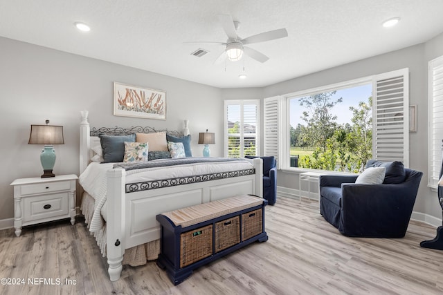 bedroom featuring recessed lighting, light wood-type flooring, visible vents, and baseboards