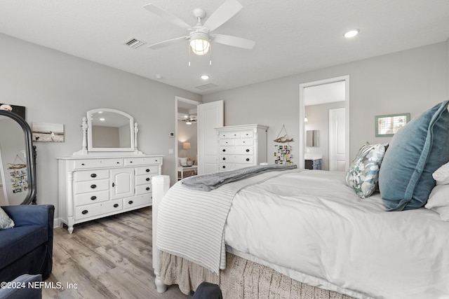 bedroom featuring connected bathroom, recessed lighting, visible vents, a ceiling fan, and light wood-type flooring