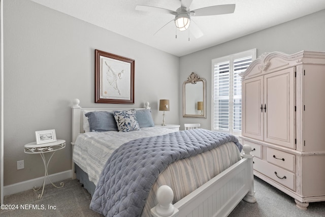 carpeted bedroom with a ceiling fan and baseboards