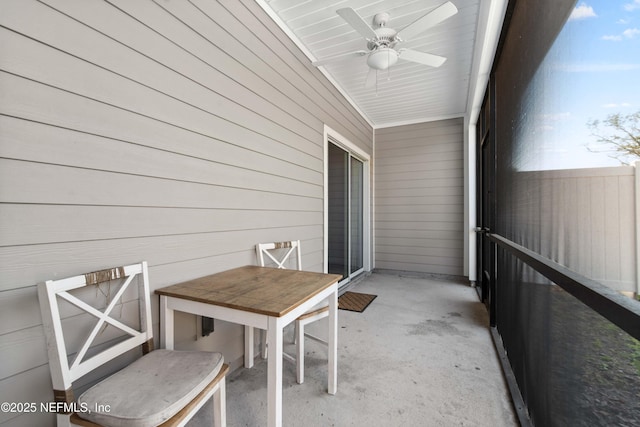 unfurnished sunroom featuring a ceiling fan