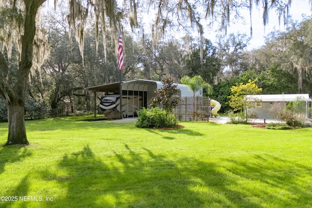 view of yard with a carport