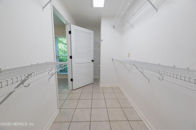 walk in closet featuring light tile patterned floors