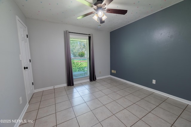 unfurnished room featuring baseboards and a ceiling fan