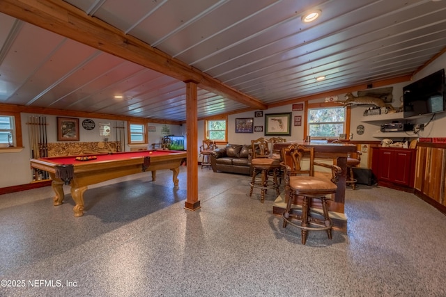 rec room featuring vaulted ceiling, pool table, a bar, and speckled floor