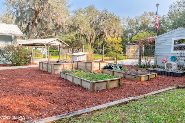 view of yard featuring a vegetable garden and fence