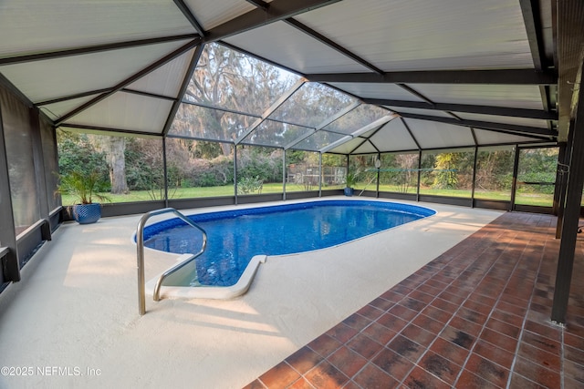 outdoor pool with a patio area and a lanai