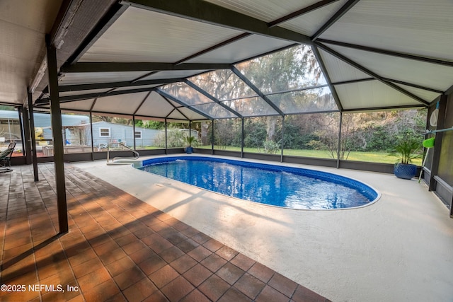 pool featuring a lanai and a patio area