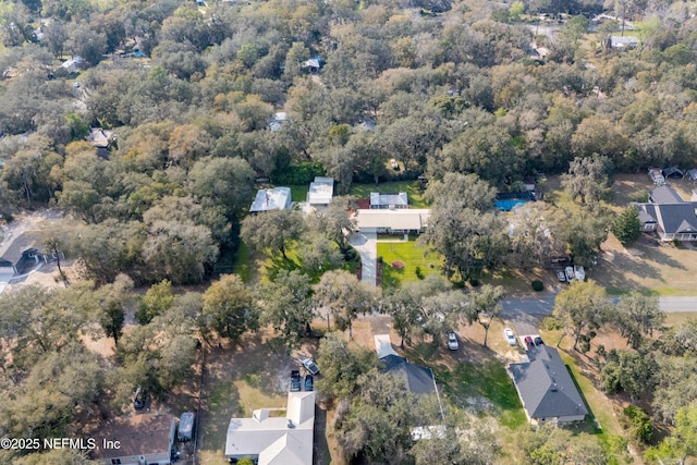 birds eye view of property with a residential view and a view of trees