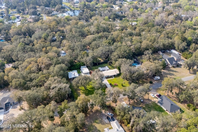 aerial view with a wooded view