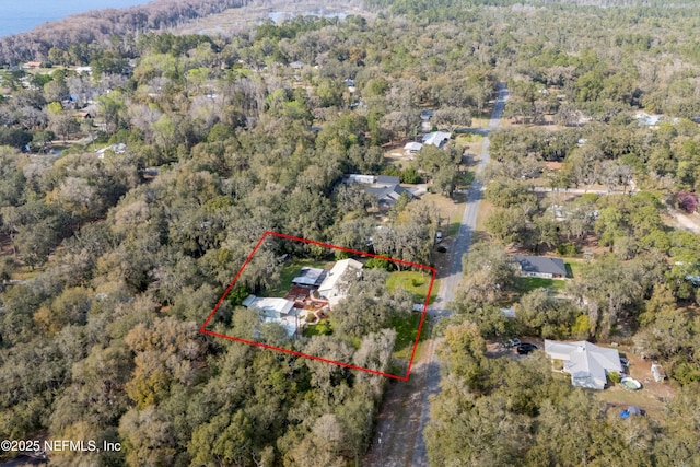 bird's eye view featuring a forest view