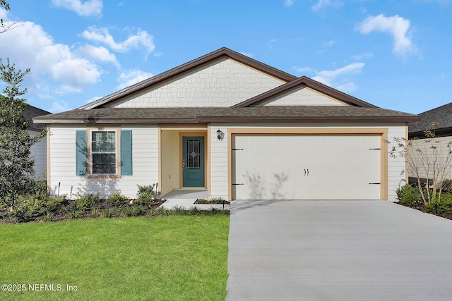 view of front facade featuring a garage, a shingled roof, a front lawn, and concrete driveway