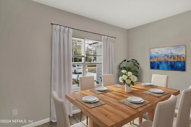 dining area featuring baseboards