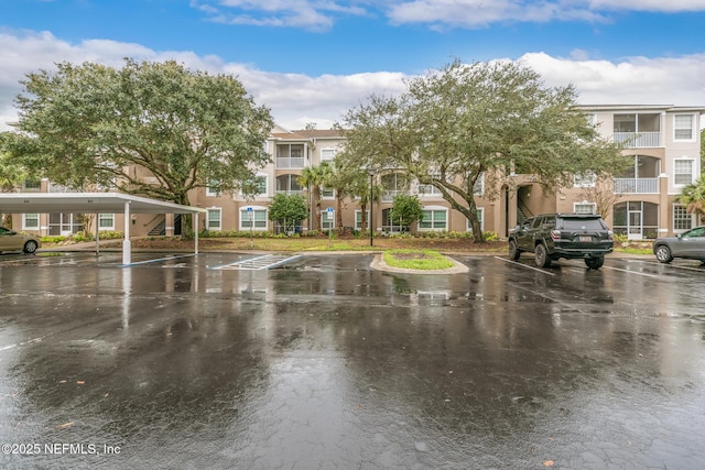 view of home's community with uncovered parking