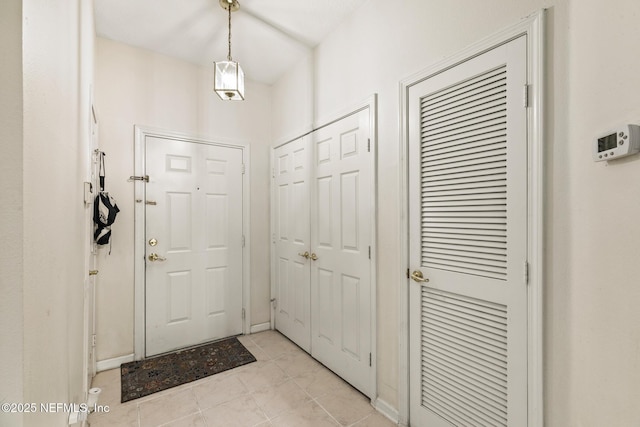 entryway featuring light tile patterned floors