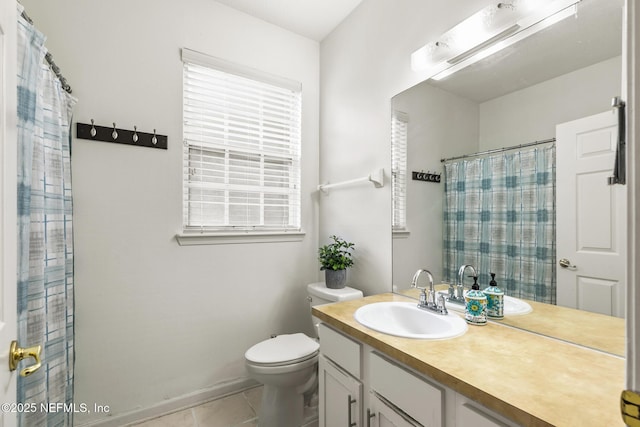 full bathroom featuring toilet, curtained shower, vanity, and tile patterned floors