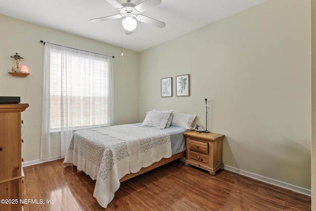 bedroom featuring dark wood finished floors, baseboards, and ceiling fan