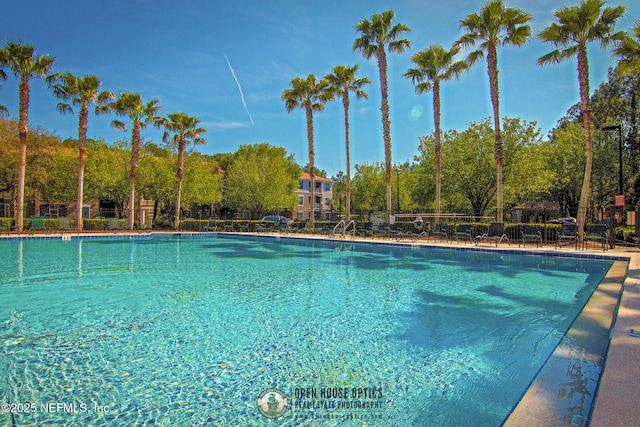 community pool featuring fence