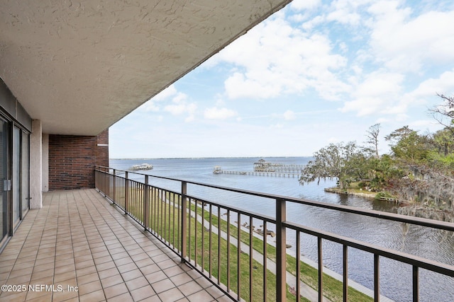 balcony featuring a water view