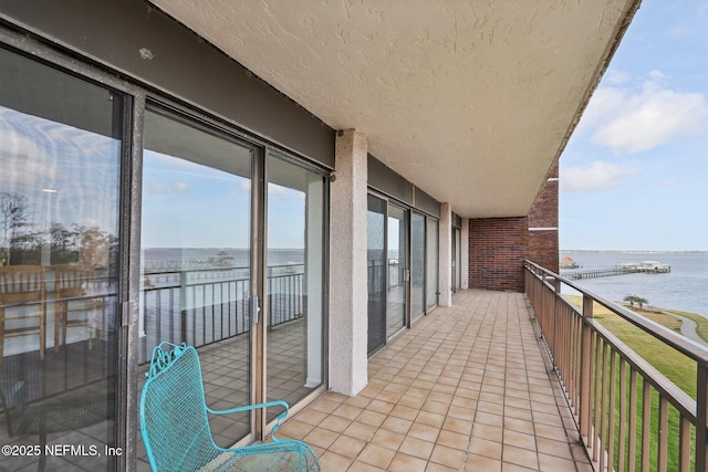 balcony featuring a water view