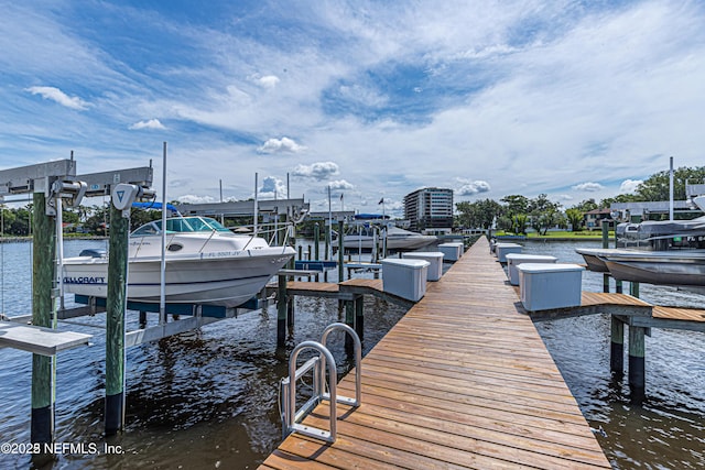 dock area with a water view and boat lift