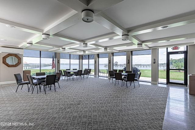 sunroom / solarium featuring beamed ceiling and coffered ceiling