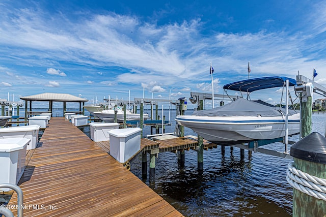 dock area featuring a water view and boat lift