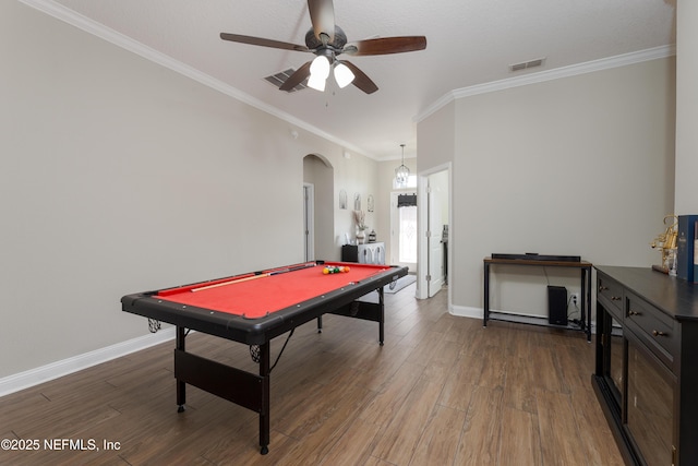 recreation room with arched walkways, wood finished floors, and visible vents