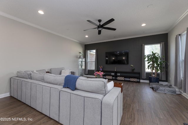 living room featuring crown molding, recessed lighting, ceiling fan, wood finished floors, and baseboards