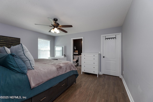 bedroom with dark wood-style floors, ensuite bathroom, a ceiling fan, a textured ceiling, and baseboards