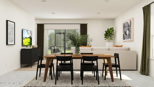 dining room featuring baseboards