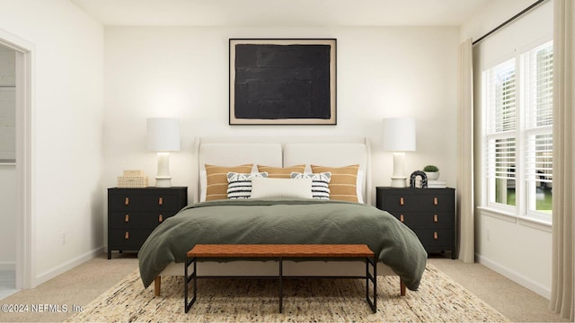 carpeted bedroom featuring baseboards