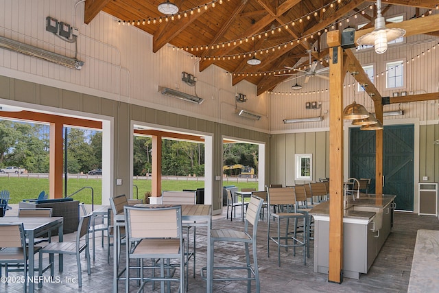 view of patio featuring outdoor wet bar and outdoor dining area