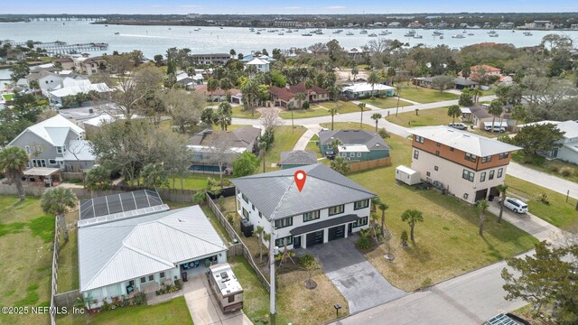 birds eye view of property featuring a water view and a residential view