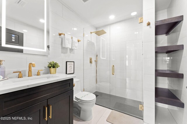 full bathroom with toilet, a stall shower, visible vents, and tile walls