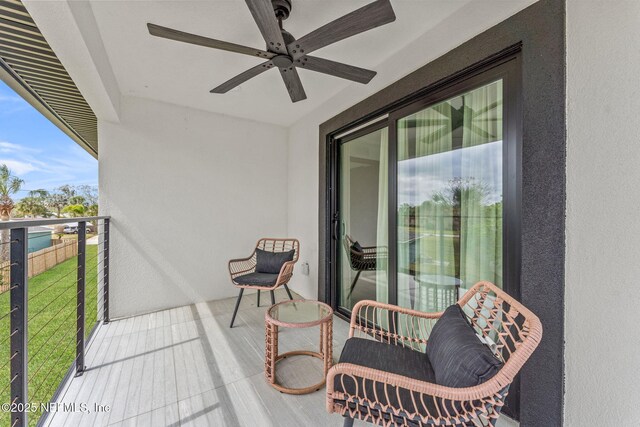 balcony featuring ceiling fan