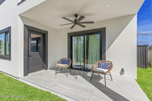 view of patio featuring a ceiling fan