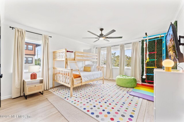 bedroom with ceiling fan and wood finished floors