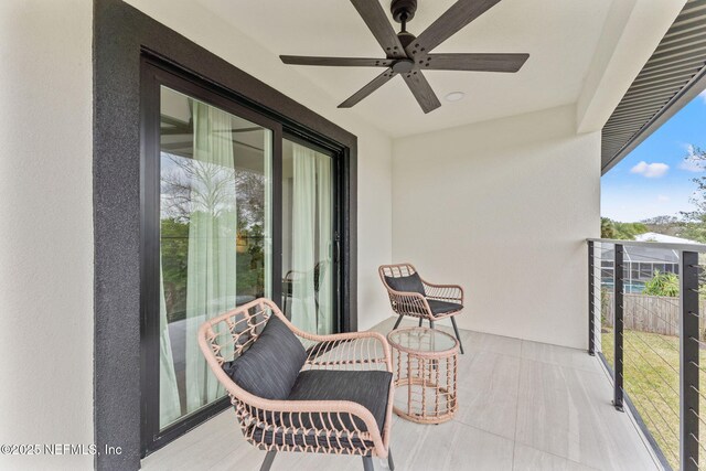 balcony with ceiling fan and a sunroom