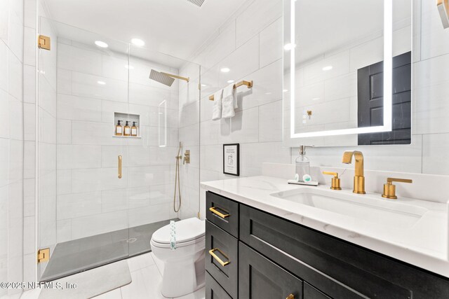 full bath with tile walls, tasteful backsplash, toilet, a shower stall, and vanity