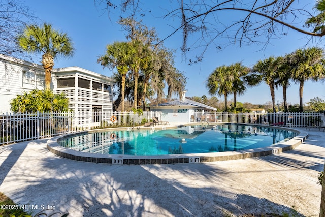 pool featuring a patio area and fence