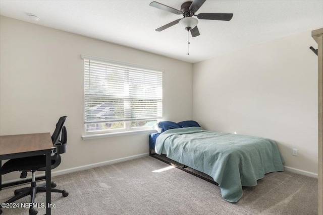 bedroom featuring carpet, baseboards, and a ceiling fan