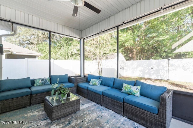 sunroom featuring ceiling fan