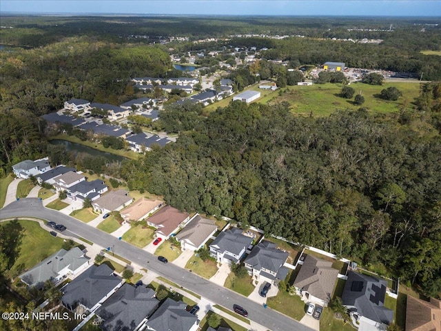 bird's eye view featuring a residential view and a view of trees