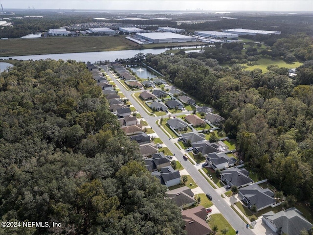 bird's eye view featuring a water view and a residential view