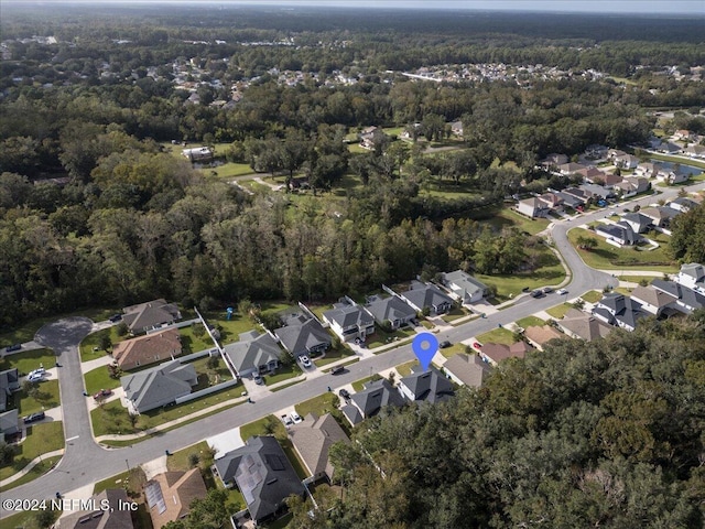 aerial view featuring a residential view and a view of trees