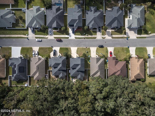 birds eye view of property with a residential view