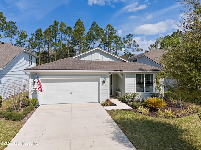 ranch-style house featuring board and batten siding, concrete driveway, a shingled roof, and a garage